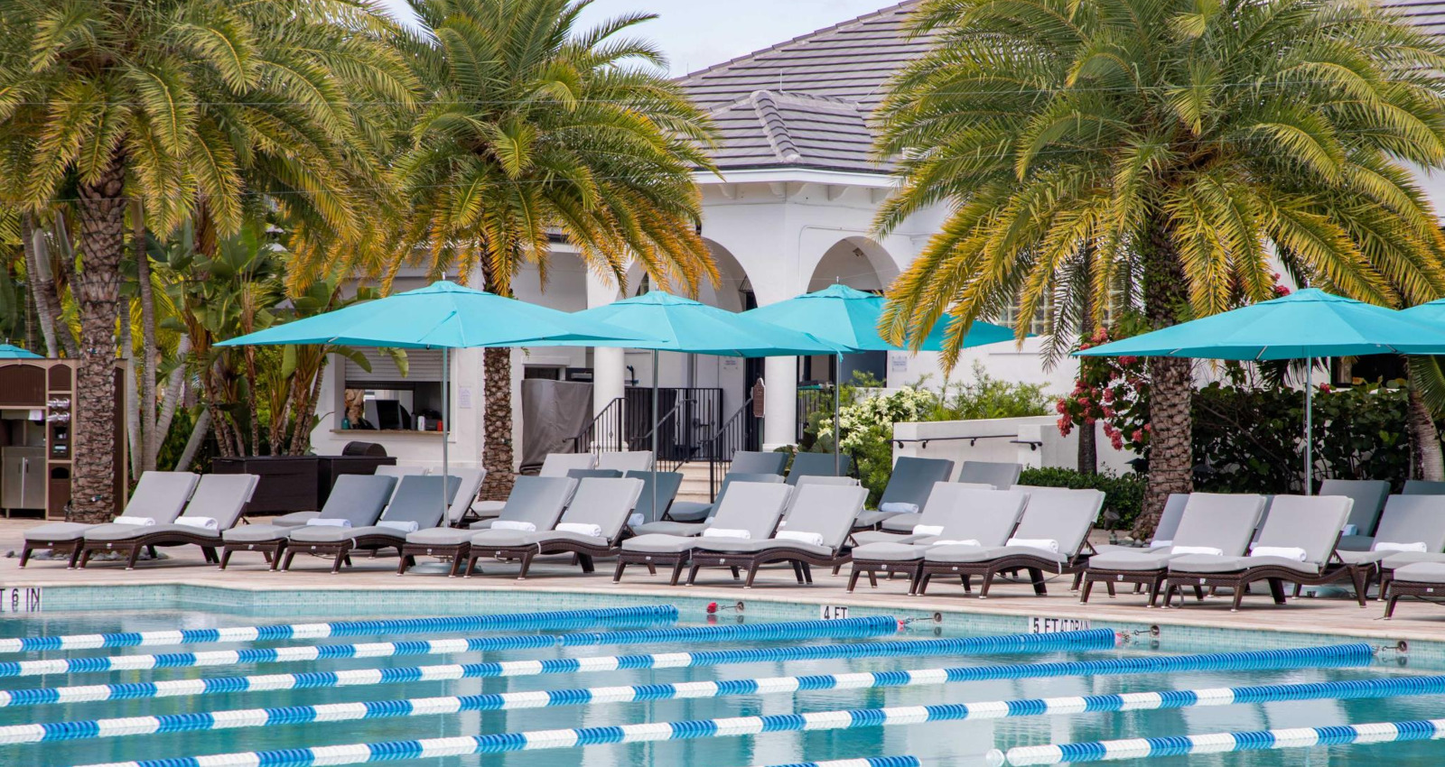 Resort-style aquatics deck and lap pool at Broken Sound Club
